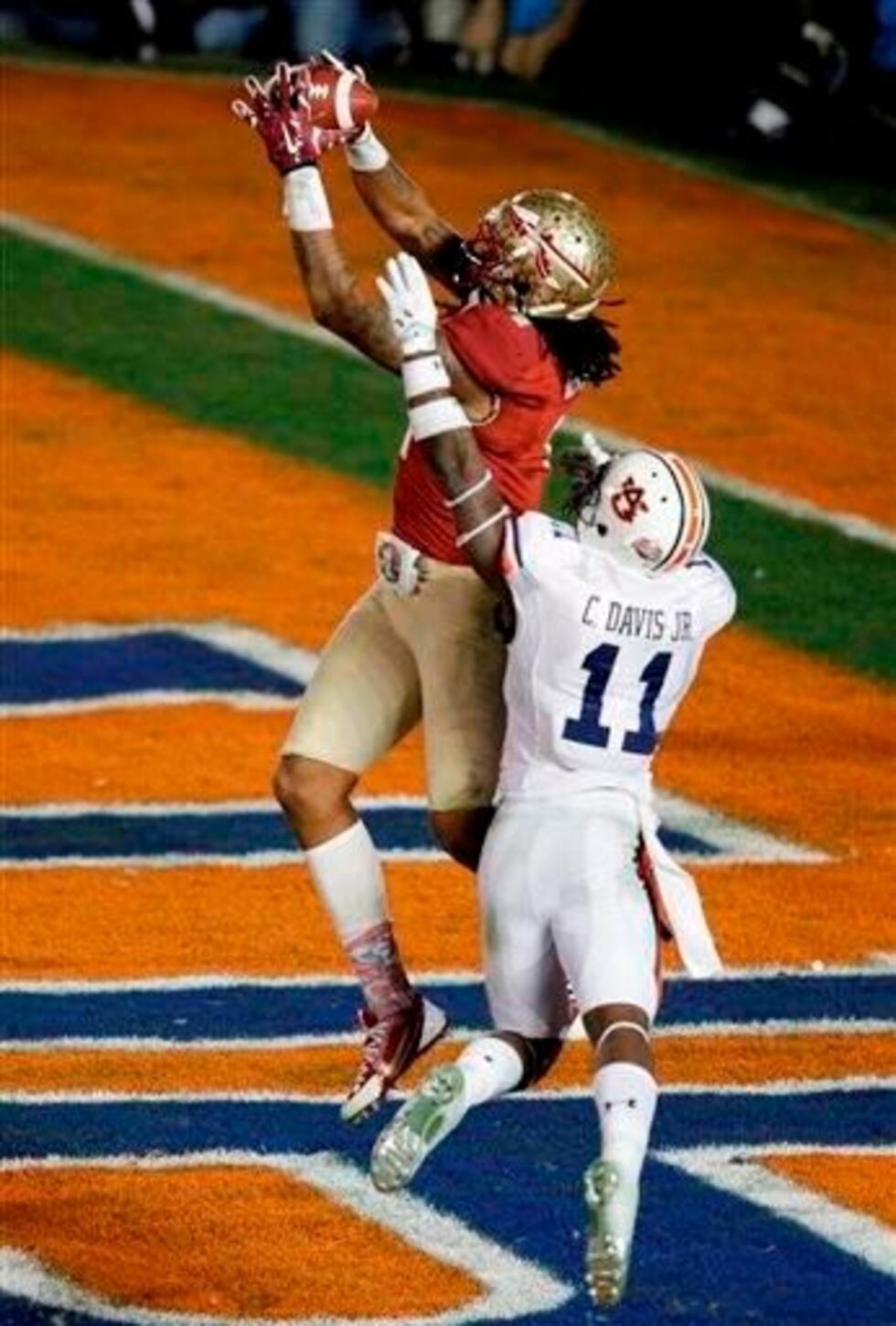 (AP Photo/Gregory Bull). Florida State's Kelvin Benjamin catches a touchdown pass in front of...