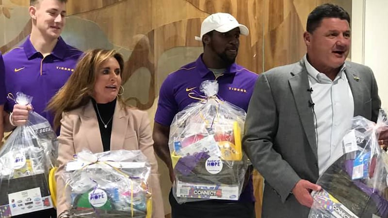 Coach O and his wife Kelly deliver baskets of hopes to kids at OLOL  Children's Hospital
