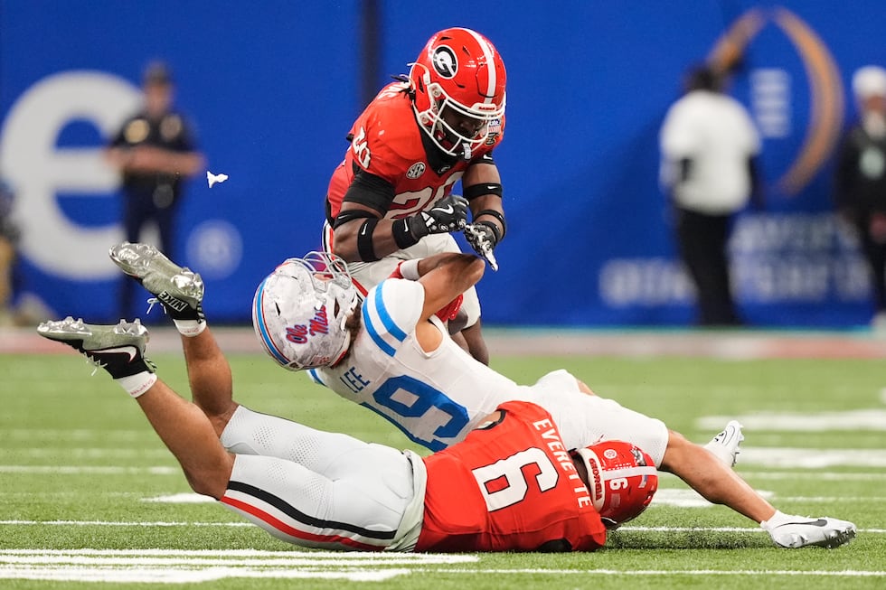 Georgia defensive back Jacorey Thomas (20) hits Mississippi wide receiver Cayden Lee (19),...