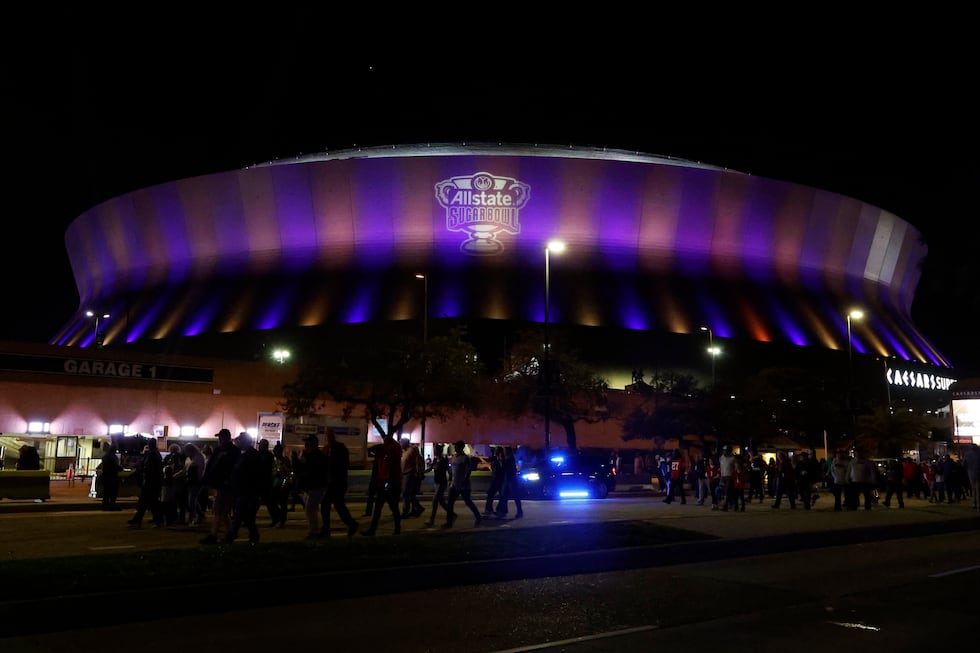 Fans leave the Caesars Superdome after the Sugar Bowl NCAA College Football Playoff game,...