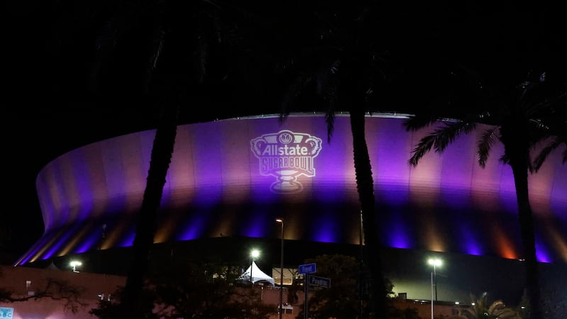 Fans leave the Caesars Superdome after the Sugar Bowl NCAA College Football Playoff game,...