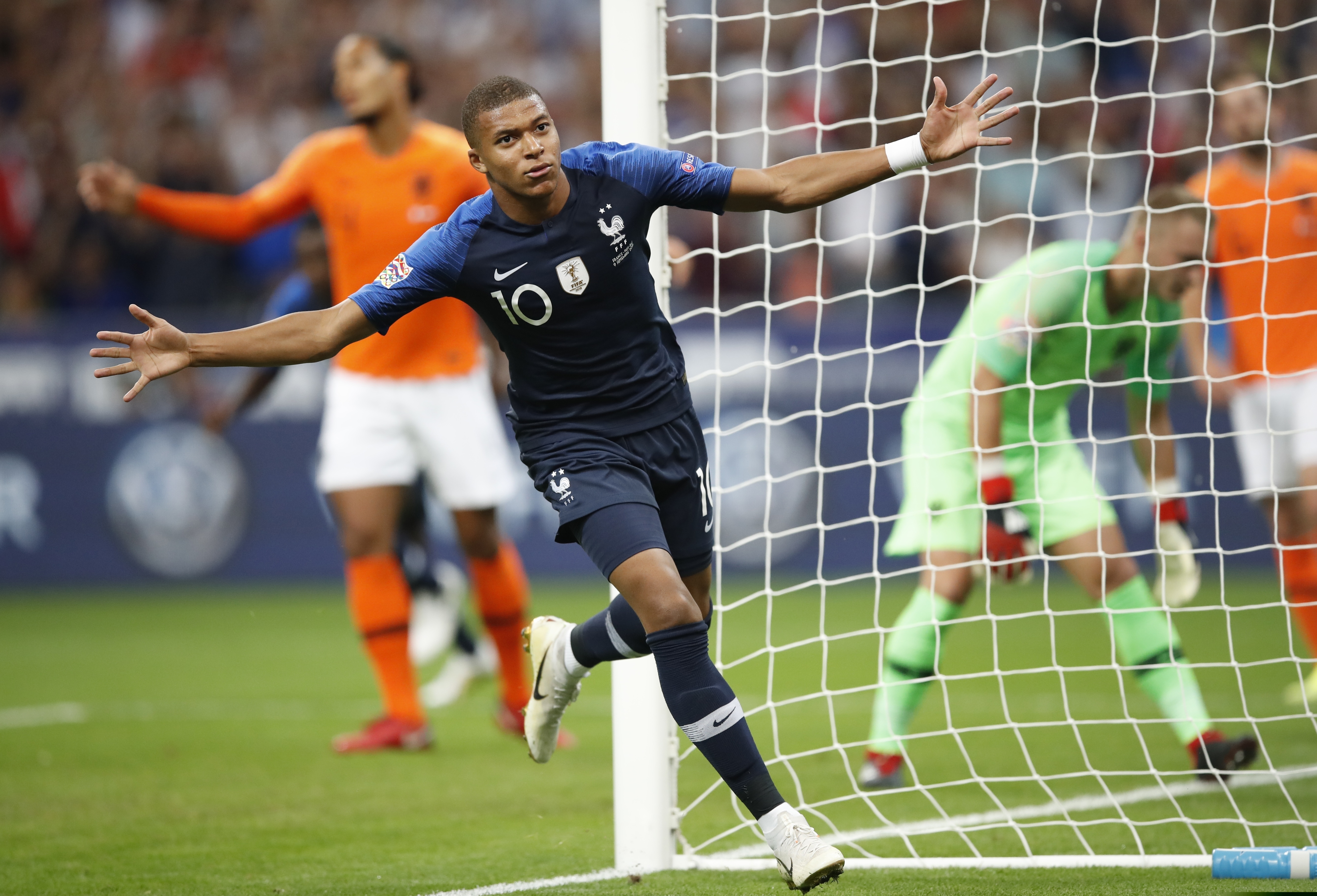 France's Kylian Mbappe celebrates after scored his side's opening goal during the UEFA Nations...